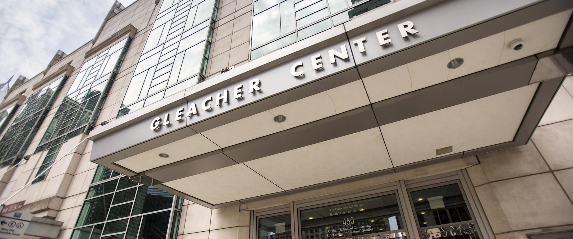 The Gleacher Center sign on the awning above the entrance to the building